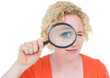 © vectorfusionart - Pretty blonde looking at magnifying glass