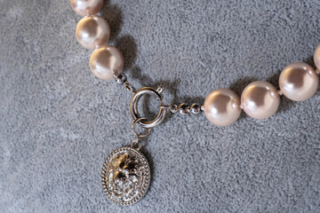 author beautiful  soft pink pearls necklaces demonstrated on model. fashion and jewelry concept. cmacro shoot