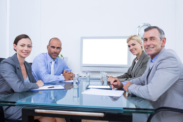 Poster - Business team looking at white screen