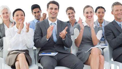 Canvas Print - Business people applauding during meeting 