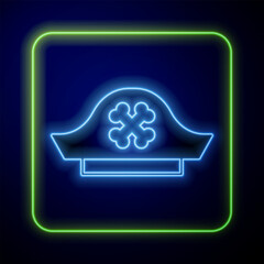 Poster - Glowing neon Pirate hat icon isolated on blue background. Vector