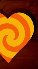 Poster - Animation of rotating orange spiral background over heart shapes hole in brown wooden surface