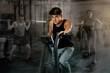 © JackF - Motivated young guy leading healthy active lifestyle doing cardio workout on exercise bike in gym