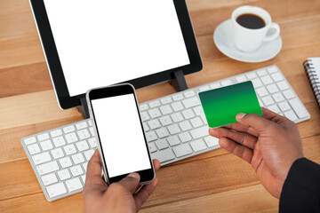 Canvas Print - High angle view of businessman doing online shopping on mobile phone