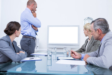 Poster - Business team looking at white screen