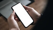 © Warm Right - Person hand holding blank white screen mobile smart phone with blurred background for advertisement (AI Generated)