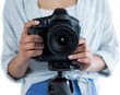© vectorfusionart - Mid section of woman holding digital camera