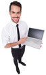 Smiling businessman pointing his laptop