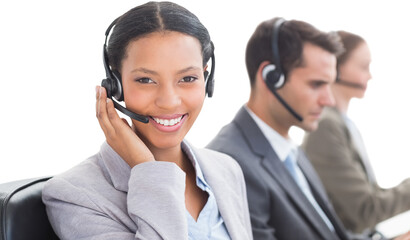 Canvas Print - Business people with headsets using computers 