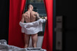 Man with naked body muscular shoulders. Naked man in bed. Muscular sexy male body. Gay sexy model. Muscular sexy man with naked torso near window curtains. Hunk with athletic body. Guy enjoying night.