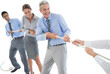 © vectorfusionart - Business people pulling rope
