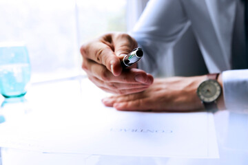 Wall Mural - Businessman is givving a pen to sign a contract