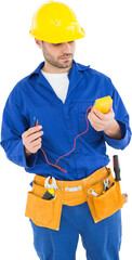 Wall Mural - Repairman examining multimeter