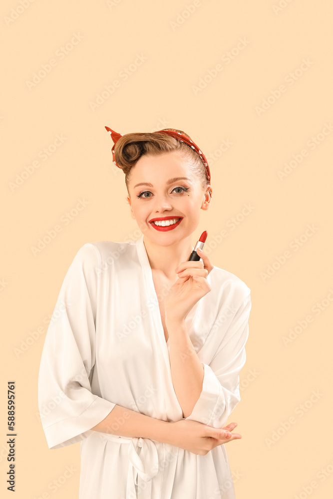 Young pin-up woman with red lipstick on beige background