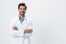 Man Doctor In A White Coat With A Stethoscope Smile With Teeth And Good Test Results Looking Into The Camera On A White Isolated Background, Copy Space, Space For Text, Health