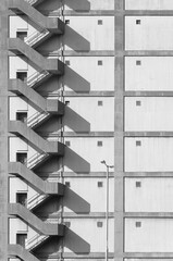 Poster - Staircase on exterior of high rise warehouse. Building abstract background