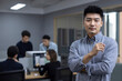 © Blue Jean Images - Portrait of Chinese IT worker in office
