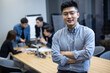© Blue Jean Images - Portrait of Chinese IT worker in office