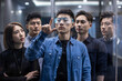 © Blue Jean Images - Confident Chinese designers checking futuristic glasses
