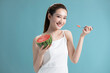 © Blue Jean Images - Beautiful young Chinese woman with watermelon