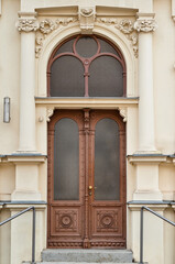 Sticker - View of old building with brown door