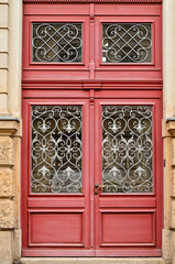 Wall Mural - View of old building with red door