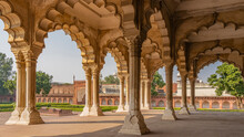 The Architecture Of The Palace In The Red Fort. An Open Pavilion Of Divan-i-Am With Columns And Carved Arches. There Is A Gallery Around The Perimeter Of The Courtyard. An Old Cannon On The Square.
