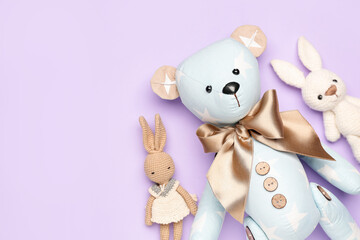 Wall Mural - Toy bear with bunnies on lilac background