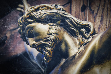 Wall Mural - Retro styled image of an ancient statue of the crucifixion of Jesus Christ.