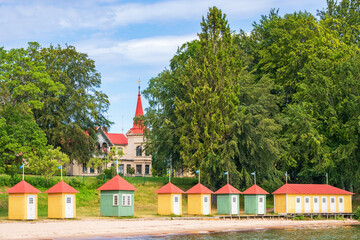 Canvas Print - Beach with beach cabins at Hjo city in Sweden