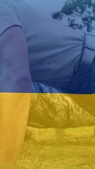 Poster - Animation of flag of ukraine over diverse male soldiers exercising