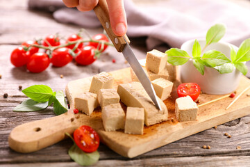 Poster - Tofu cube cutting on wooden board