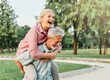 © Lumos sp - woman man outdoor senior couple happy lifestyle retirement together smiling love fun elderly active vitality nature mature portrait piggyback game