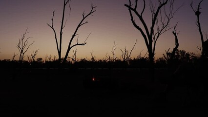 Poster - Time-lapse shot of campfire at sunset.