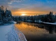 a view of the river from a bridge at sunset during winter