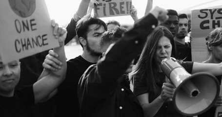 Wall Mural - Crowd of multiracial people fight for climate change - Group of demonstrators protest in the city - Black and white editing