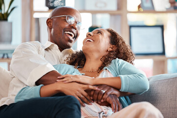 Poster - Love, happy and couple laugh on sofa for bonding, quality time and relaxing together at home. Marriage, relationship and black man and woman on couch embrace, hugging and laughing for funny joke