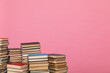 scientific literature of knowledge in the library on the pink background of a stack of books