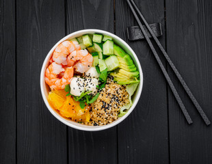 Canvas Print - Poke bowl with shrimp, quinoa, avocado, cucumber, cream cheese and orange.