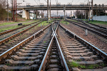 Wall Mural - Industrial logistic and transportation concept background, forward railway track switch for train. Railway and industrial area of city