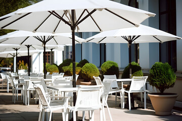 White Patio Umbrellas in Outdoor Cafe