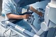 © Georgii - Hands of a surgeon at a computer robot. medical robot. Robotic Surgery.