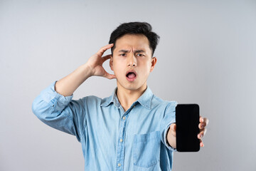 Wall Mural - image of young businessman male on gray background