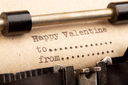 Happy Valentine - phrase on typewriter. Valentines Day greetings concept. Valentines greeting card.