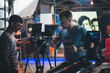 © Anna - Director of photography with a camera in his hands on the set. Professional videographer at work on filming a movie