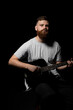 © Volodymyr - Portrait of young bearded handsome guitarist, artist, composer, pop rocker star. Music concept.