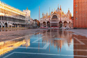 Wall Mural - Piazza San Marco, St Mark Square at sunrise, deluged by flood water during High water, Venice, Italy