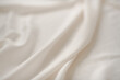 © Yuliya - White or Ivory Silk Sheet Fabric, Textured Background