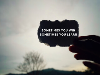 Wall Mural - Inspirational and Motivational Concept - 'sometimes you win sometimes you learn' text background.