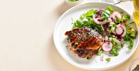 Roasted pork steak with salad from fresh vegetable